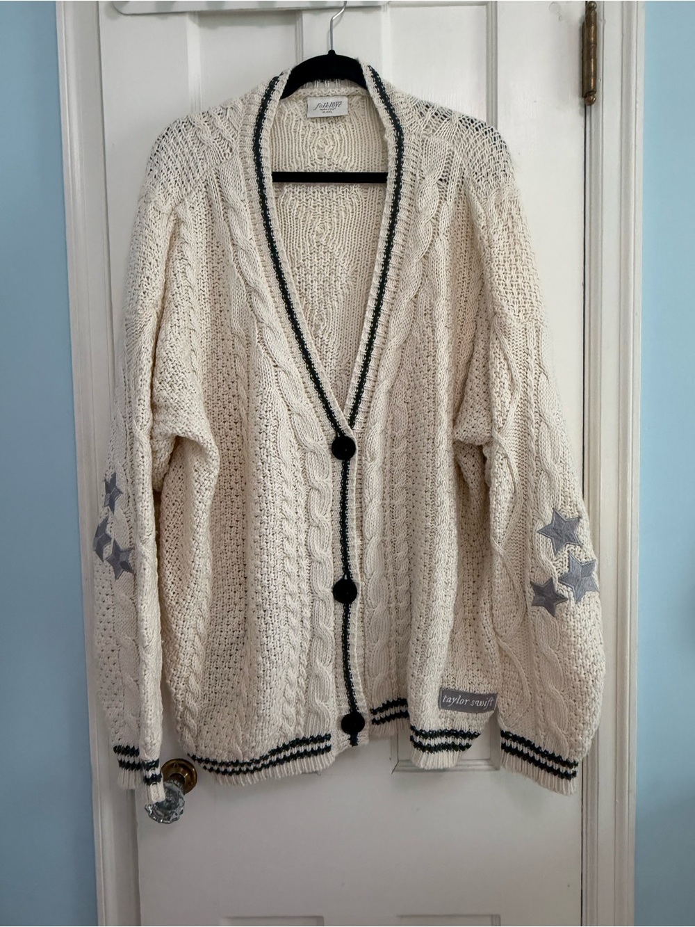 Taylor Swift Cream Cable Knit Cardigan with Black Trim and Star Elbow Patches